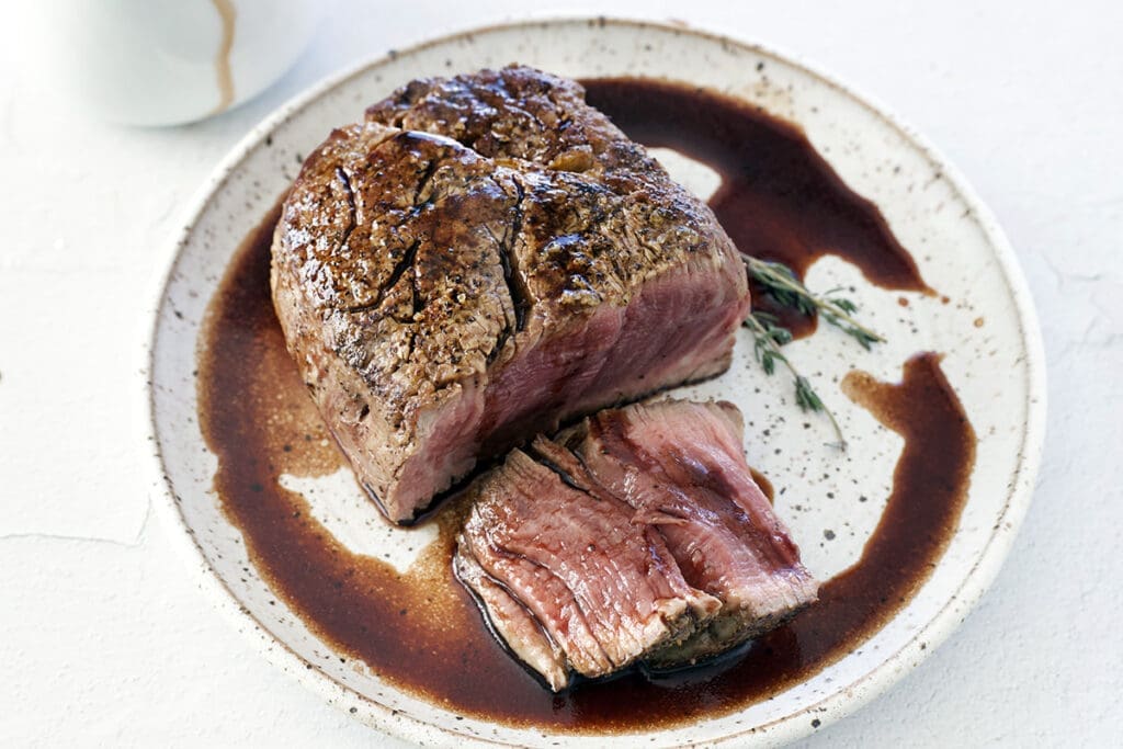 Filet mignon covered in Red wine steak sauce.