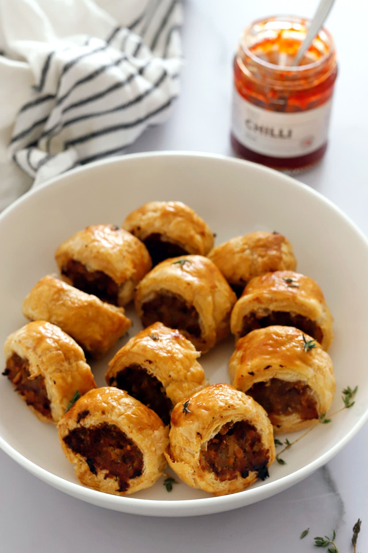 Pork and apple sausage rolls made with puff pastry.