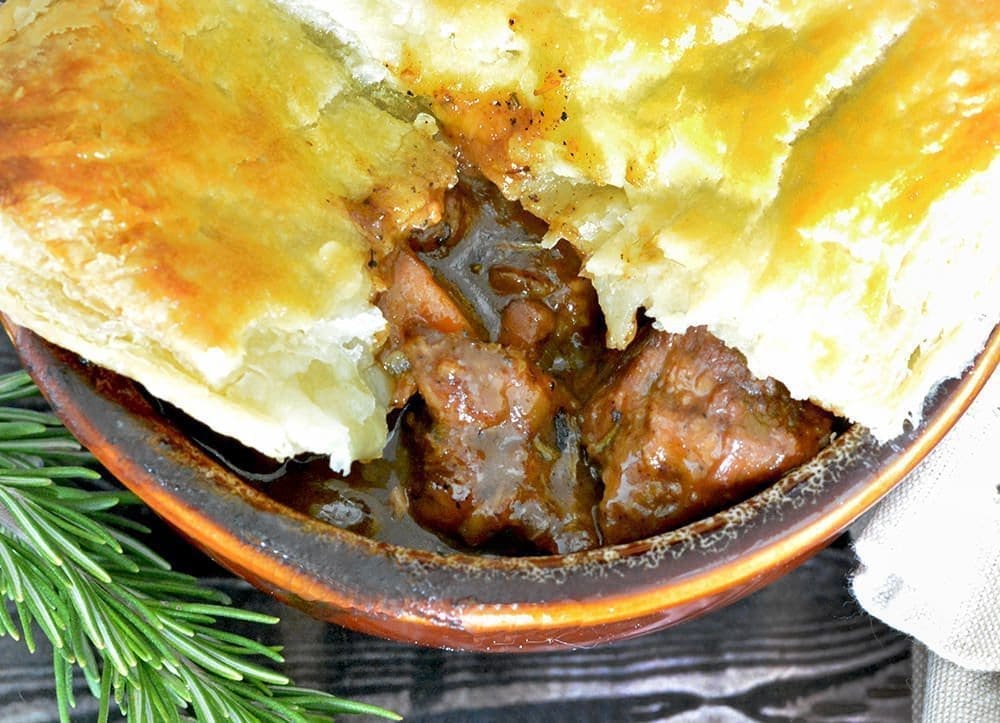 Shepherd's pie recipe with sprig of rosemary.