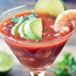 Mexican Shrimp Cocktail topped with a single shrimp and avocado.