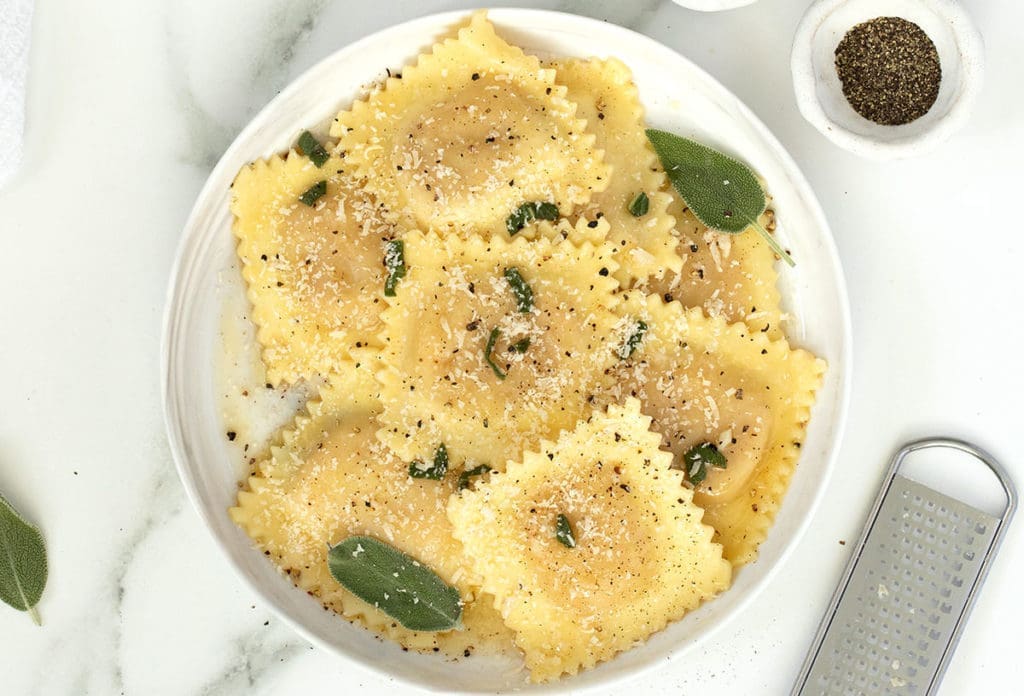 Butternut Squash Ravioli on a white plate.
