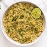 Arroz verde in a white bowl.