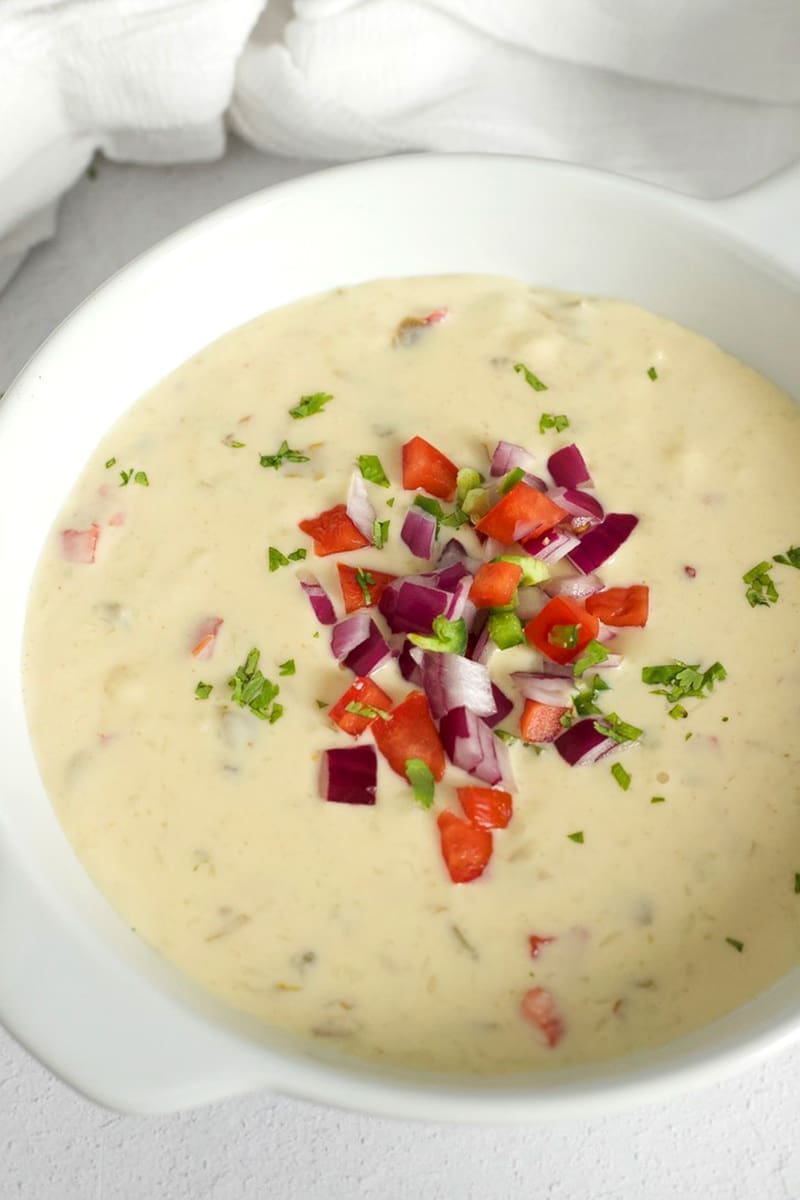White Queso topped with pico de Gallo.